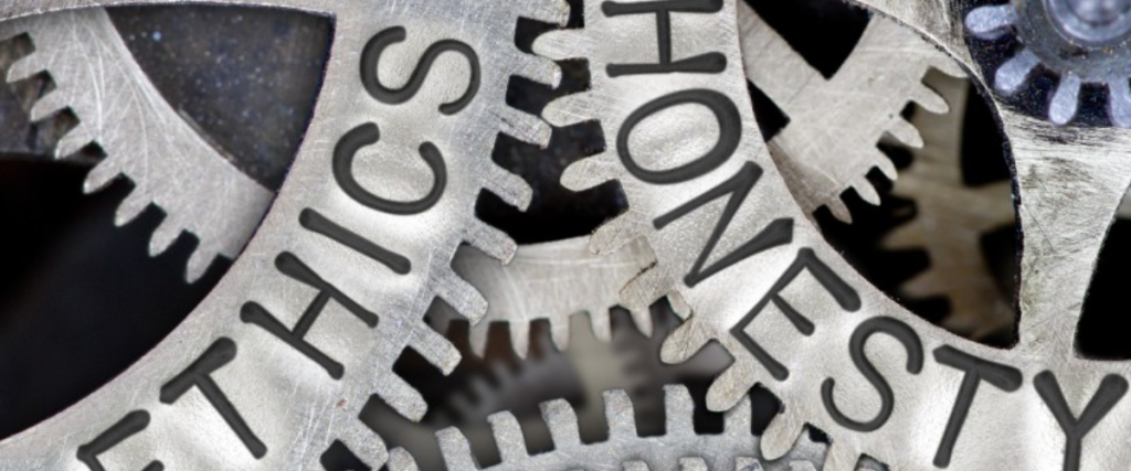 Mechanical cogs displaying the words honesty and ethics