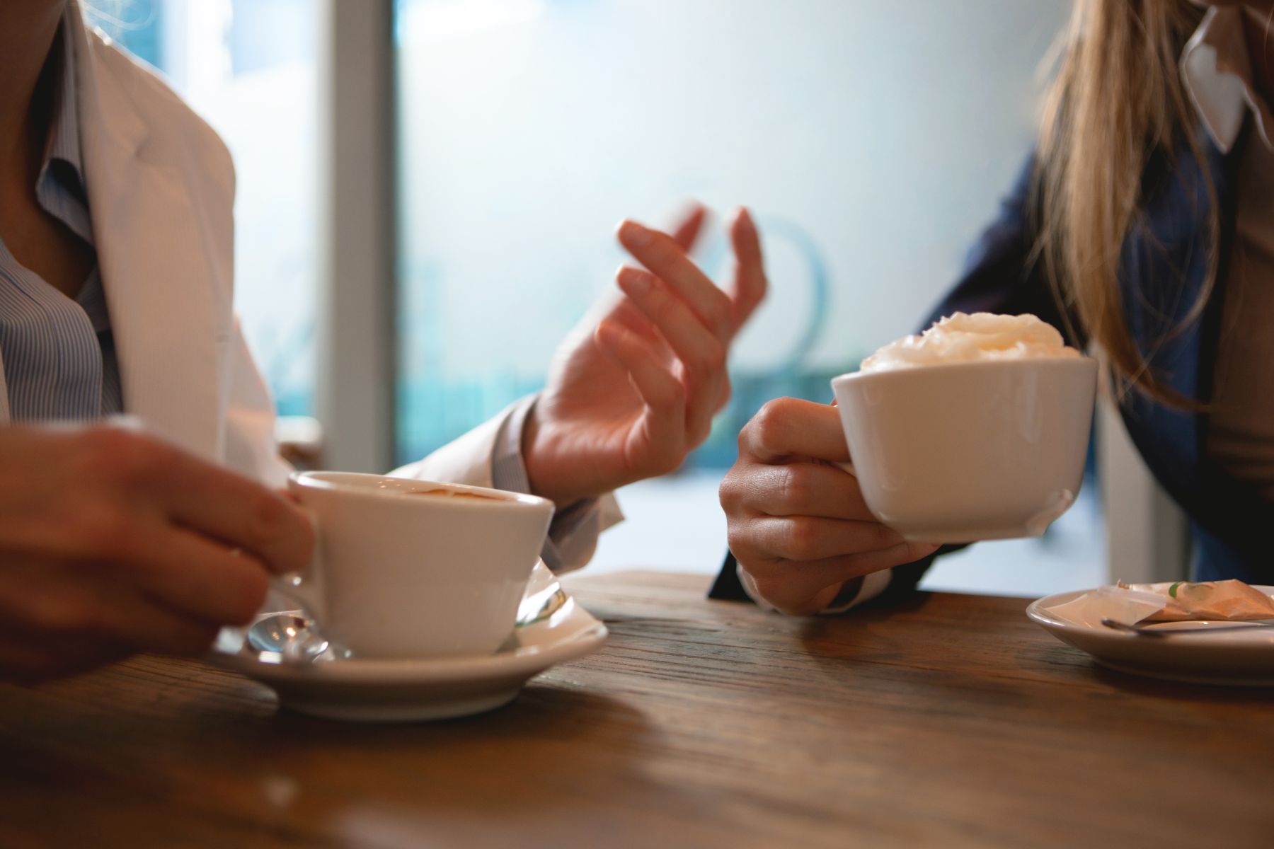 An image of two people having coffee, to reflect the real conversation in HR marketing