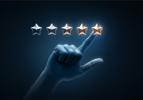 A graphic displaying five stars with a finger pointing to the brightest star, reflecting the ambition to be a premium brand
