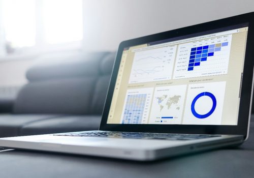 A laptop showing imagery associated with market trends reports